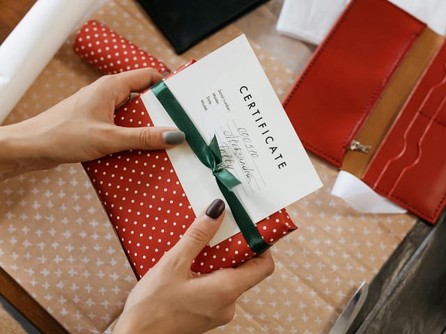 close up shot of a person holding a present