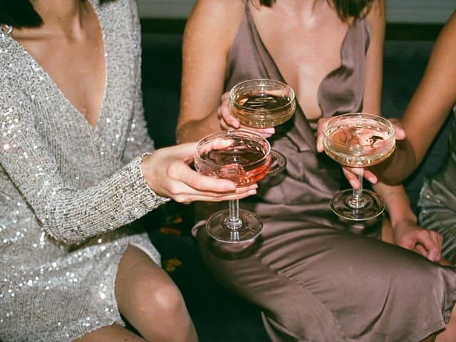 woman in silver v neck long sleeved dress