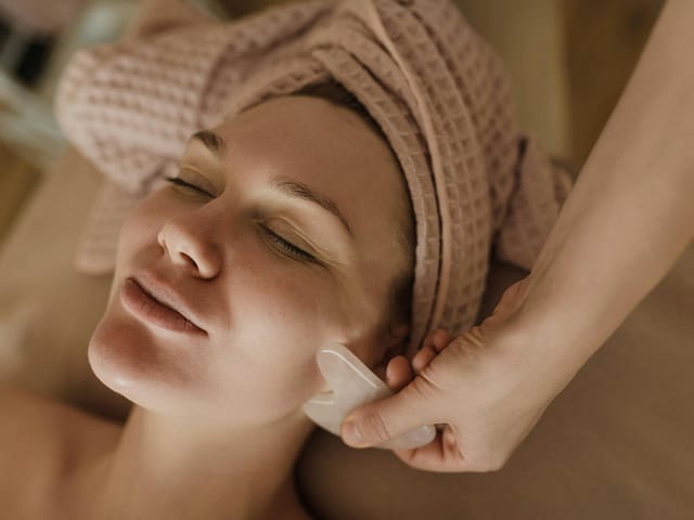 woman in facial treatment massage